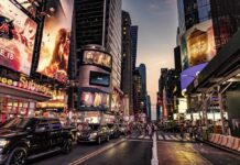 A Luxury Project Hits A Dangerous Snag Busy street scene in Times Square with cars and pedestrians