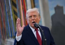 Trump Declassifies Election Files, Sparks Fresh Debate A man speaking passionately into a microphone with his hand raised