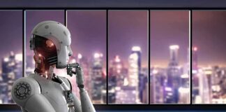 Humanoid robot thinking by window overlooking blurred city skyline