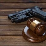A Zero-Dollar Tax Just Cost Washington in Court Gavel and handgun on wooden table