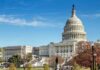 United States Capitol building with dome and autumn trees