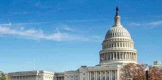 United States Capitol building with dome and autumn trees