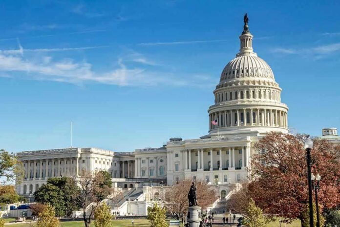 United States Capitol building with dome and autumn trees