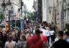 Crowd of pedestrians on a busy city sidewalk