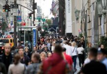 When History Disappears From An Official Map Crowd of pedestrians on a busy city sidewalk