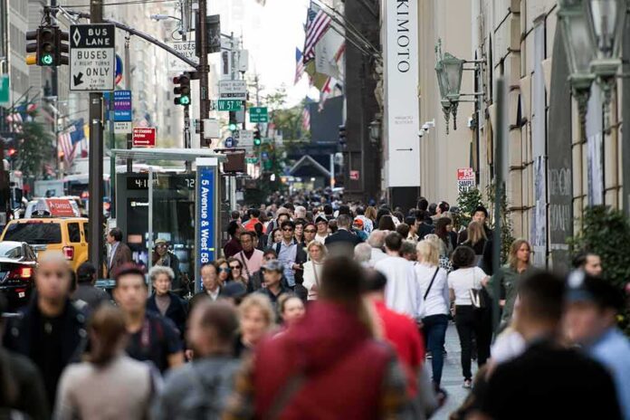 Crowd of pedestrians on a busy city sidewalk