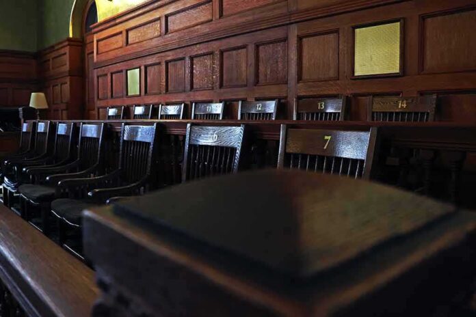 Empty wooden jury box with numbered chairs