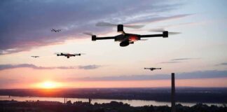 Drones flying over a river landscape at sunset