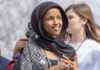 Ilhan Omar’s Minneapolis Fortress Still Looks Impenetrable woman in a black headscarf at an outdoor gathering