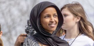 woman in a black headscarf at an outdoor gathering