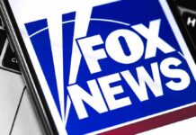A Familiar Network Faces Familiar Criticism Fox News logo displayed on a smartphone screen