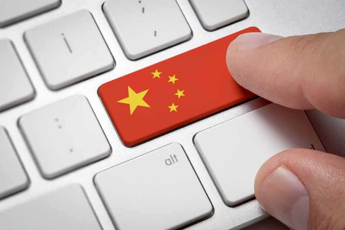 Finger pressing keyboard key with China flag design