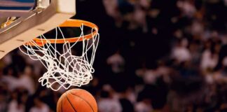 Basketball dropping through a hoop