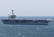 Aircraft carrier sailing at sea