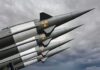 The Next War May Beat America’s Factory Clock Four military missiles with radiation symbols pointed skyward