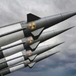 Four military missiles with radiation symbols pointed skyward