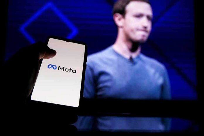 smartphone showing Meta logo in front of a blurred speaker on stage