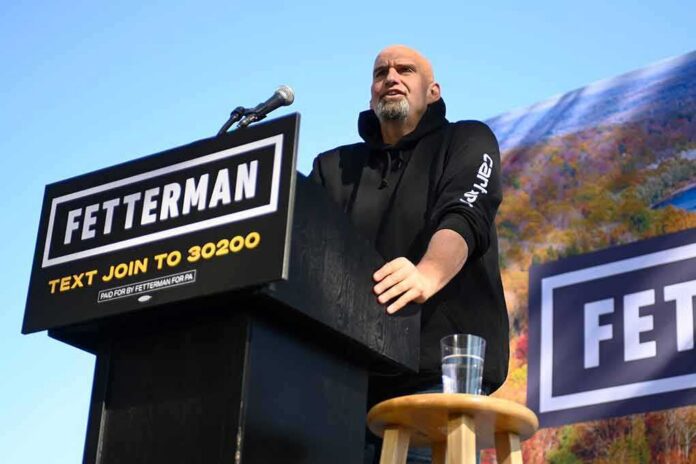 Speaker at outdoor rally standing at podium with microphone