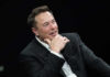 Three Outsiders Just Got a Pentagon Mission Elon Musk speaking on stage in a dark suit, resting his chin on his hand