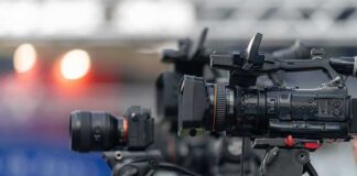 Professional video cameras on tripods