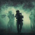 Iran Is Weaker—So Why Isn’t This Over? Soldiers move through dense smoke in a forest