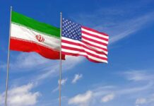 Tehran Put Seven Days Down. Washington Balked Iran and United States flags waving on flagpoles
