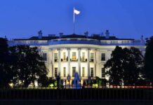 The White House illuminated at dusk