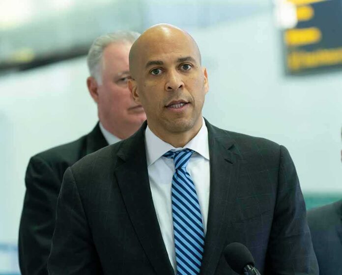 shutterstock_1278733936 man in suit speaking at a microphone