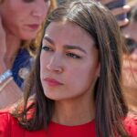 woman in red top at an outdoor event
