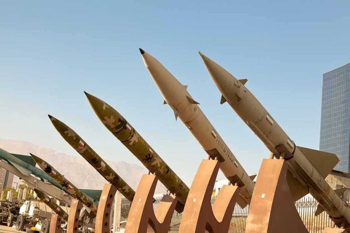 Row of surface-to-surface missiles mounted on display stands outdoors