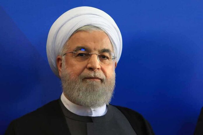 shutterstock_1519993961 Hassan Rouhani portrait against a blue background