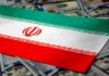 Iran flag on scattered US dollar bills