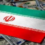Iran flag on scattered US dollar bills