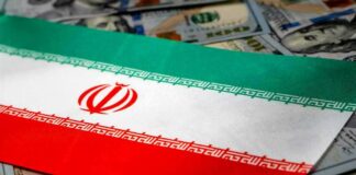 Iran flag on scattered US dollar bills
