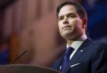 Neck-And-Neck Shock: Trump’s Heir? man in suit speaking at podium