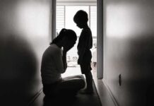 Awareness Or Sales Pitch? Moms Caught Between Silhouettes of adult and child in hallway