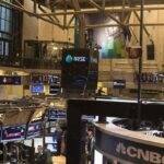 War Premium Returns To Global Oil Markets NYSE trading floor with monitors and tickers