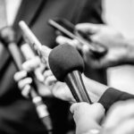 One Bizarre Analogy Derails A Serious Debate Microphones and recorders held toward a speaker