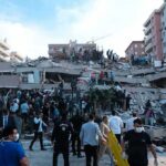 Kyiv Faces A Relentless Barrage From The Skies Rescue workers and civilians on collapsed building after earthquake