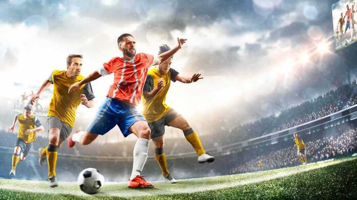 Soccer player in red jersey sprints past defenders in a stadium