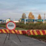 Four Years Later, Moscow Eyes The North Ukraine border crossing with stop sign and barrier