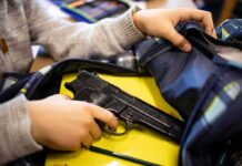 Daycare Panic: Tiny Hands, Real Gun hand reaches into backpack with a handgun inside