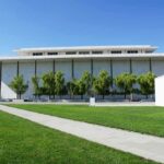 Modern cultural building with white facade and tall columns