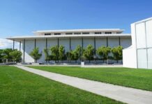Modern cultural building with white facade and tall columns