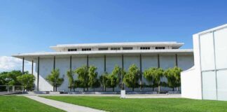 Modern cultural building with white facade and tall columns
