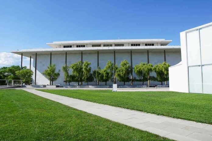 Modern cultural building with white facade and tall columns