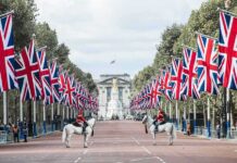 Flying Britain’s Flag Just Became A Court Battle Union Jack flags line a broad avenue with mounted guards