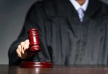 Self-Defense Win, Gun Ban Anyway Judge with gavel striking sound block
