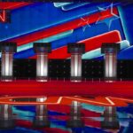 CNN Panel Goes Off the Rails Over Fauci Debate stage with four podiums and colorful star backdrop