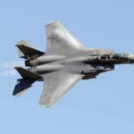fighter jet banking in clear sky